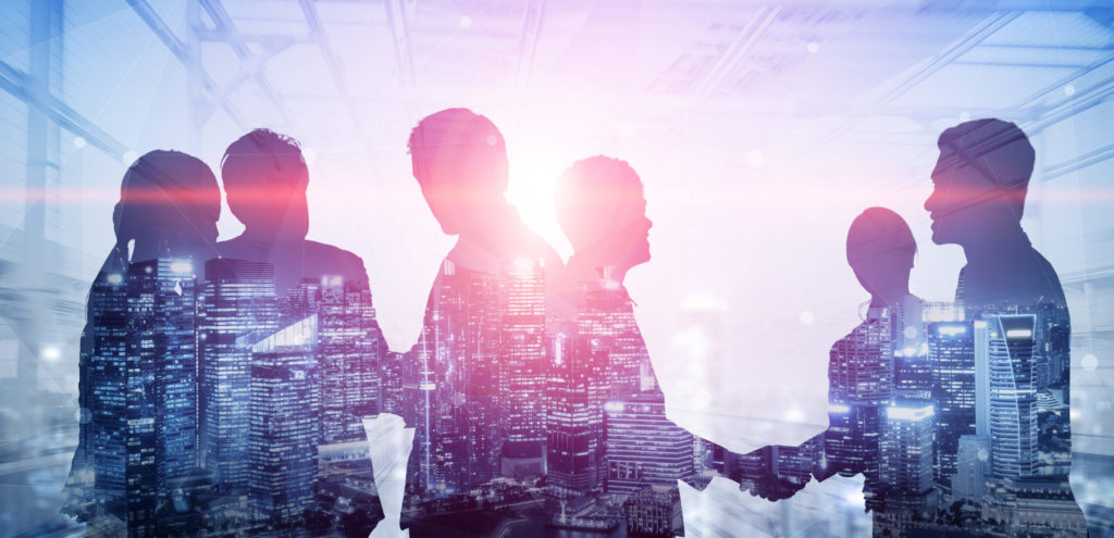 Double exposure image of many business people conference group meeting on city office building in background showing partnership success of business deal. Concept of teamwork, trust and agreement.