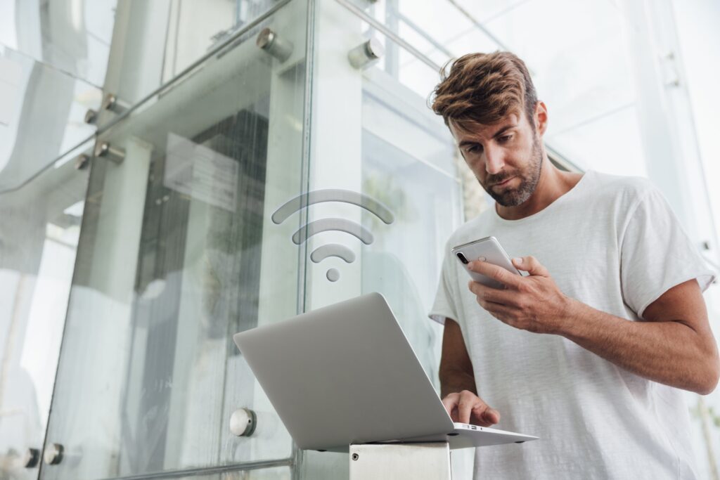 bearded man checking portable devices min